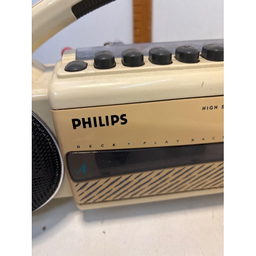 65 - Philips stereo boombox with cassette playback, dual speakers.