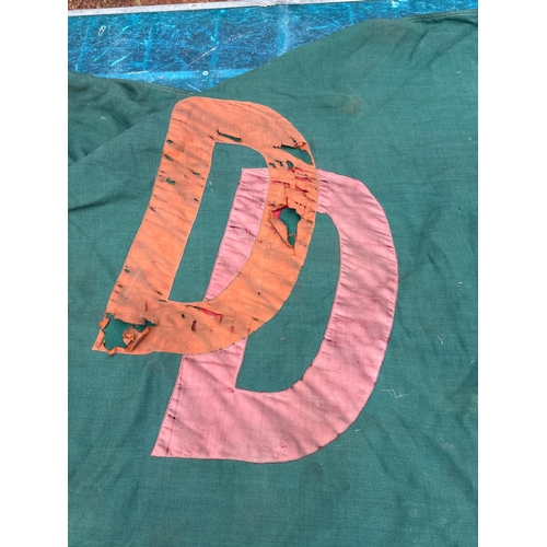82 - Green fabric flag featuring 'Double Diamond' branding and overlapped 'DD' logo. Exhibits wear, disco... 