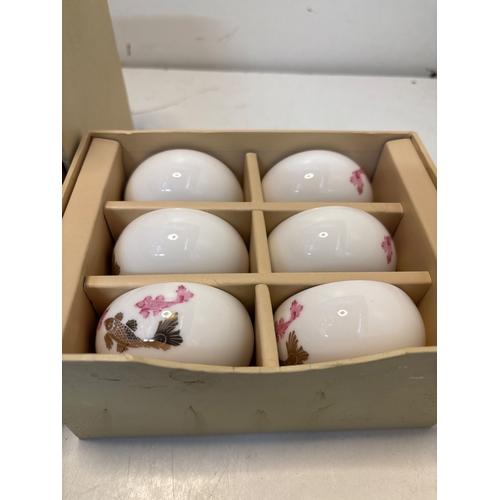 461 - Tayoha porcelain tea set including two teapots and six cups, each adorned with floral motifs, housed... 