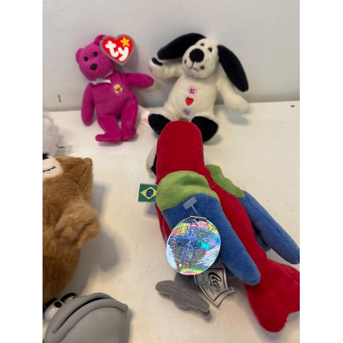 22 - Plush toys including Ty Beanie Babies, international-themed animals, a Furby, a hedgehog, and others... 