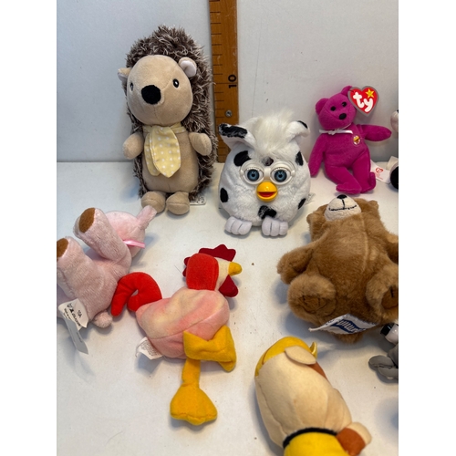 22 - Plush toys including Ty Beanie Babies, international-themed animals, a Furby, a hedgehog, and others... 