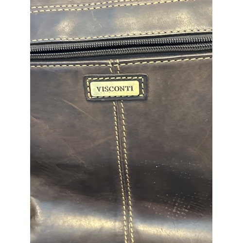 42 - Visconti brown leather shoulder bag with adjustable strap, buckle closures, and zippered back pocket... 