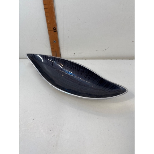 69 - Glossy blue ceramic dish featuring an abstract elongated shape.