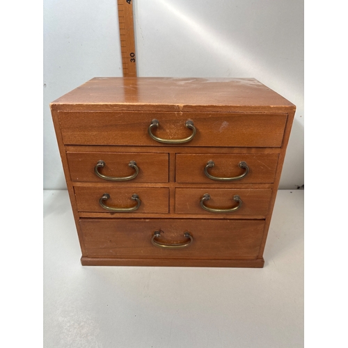70 - Small wooden chest with five drawers and brass handles.