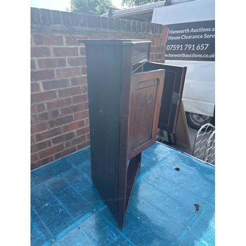 72 - Wooden cabinet with two floral-engraved doors.