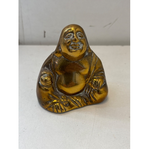 82 - brass figurine depicting a Laughing Buddha, well-polished with detailed features, approximately 3-5 ... 