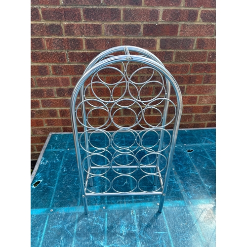 90 - Chrome wine rack with an arched top, holds 12 bottles.not postable