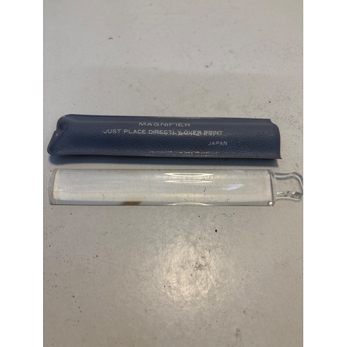 118 - Glass magnifier with a protective blue case, made in Japan.
