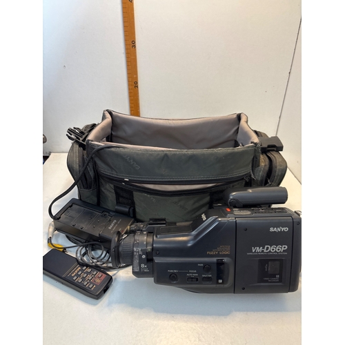 129 - Sanyo VM-D66P camcorder with soft case, remote, and cables.