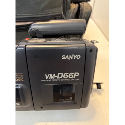 129 - Sanyo VM-D66P camcorder with soft case, remote, and cables.