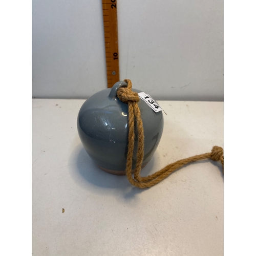 134 - Ceramic wind chime with glossy gray surface, featuring a rope hanger and an interior striker. Design... 