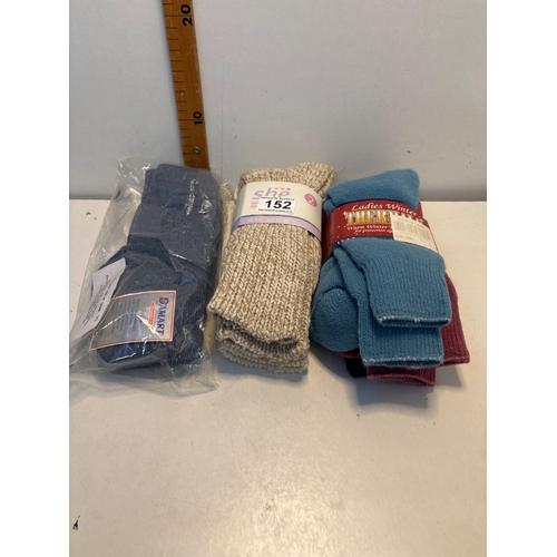 152 - Three pairs of gloves and socks in various styles and colors; items consist of packaged blue gloves,... 