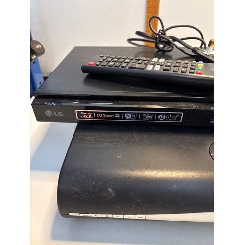 159 - LG Smart DVD player with Wi-Fi, remote control, and power cord, along with a Sky+ box.