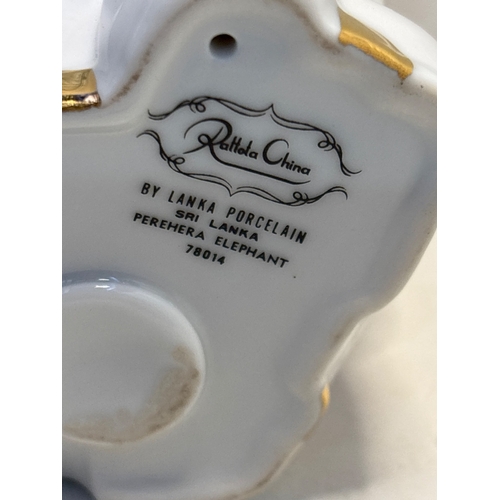 33 - Lanka Porcelain decorative elephant from Sri Lanka, made of fine china with intricate gold and orang... 