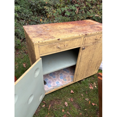 49 - Metal industrial cabinet with two doors, one drawer, and distressed paint.