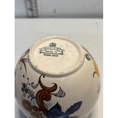 51 - Sadler jar with floral decorations, made in Staffordshire, England.
