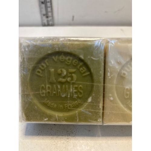 52 - Six 125-gram bars of soap labeled 'Pur Vegetal' and 'Made in France,' sealed in packaging.