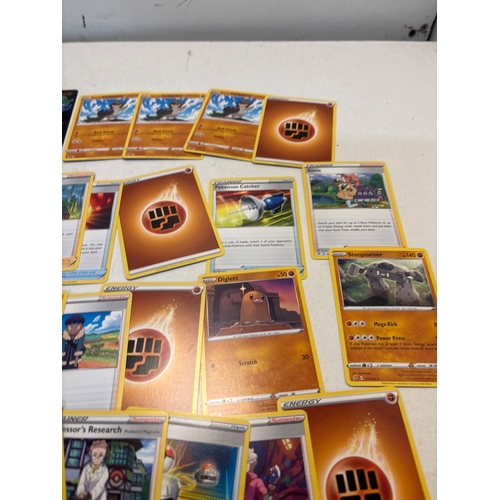 55 - Pokemon cards including energy, trainer, and holographic cards. Highlight features include cards wit... 