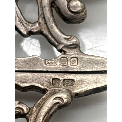 85 - Sterling silver floral buckle with engraved hallmarks.