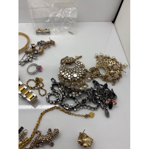 86 - Jewelry lot including necklaces, bracelets, rings, earrings, and a watch. Various materials and styl... 