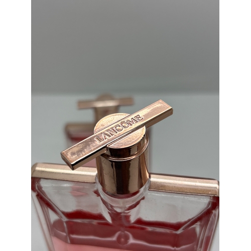 88 - Two Lancome bottles and one Lele Roze perfume.