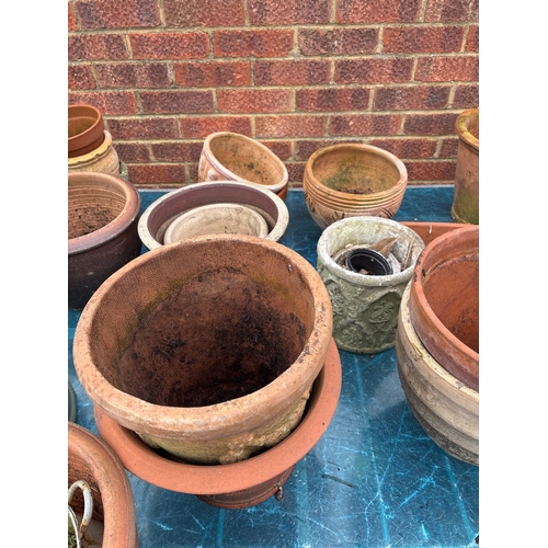 1 - Terracotta and ceramic garden pots. Includes various sizes and designs, some with signs of use and w... 
