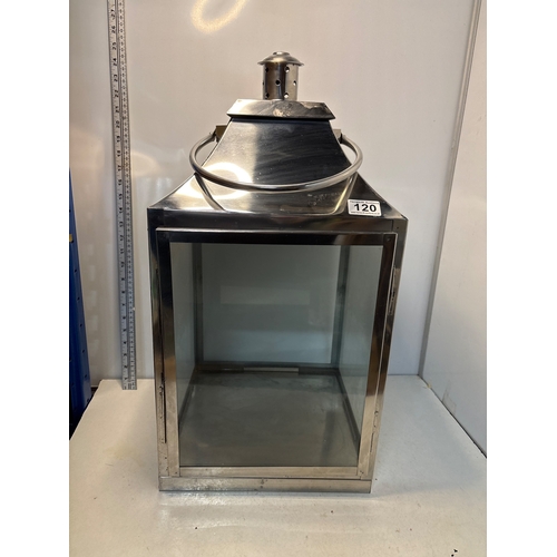 120 - Large Polished metal lantern with clear glass sides and a hinged top not postable.