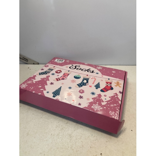 150 - Fluffy holiday-themed socks in original box.