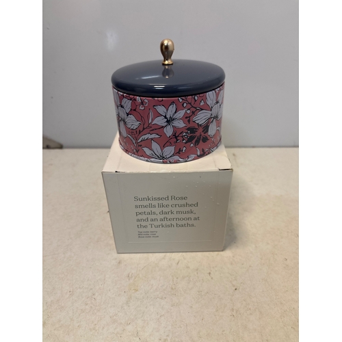 152 - Sunkissed Rose scented candle in decorative container with a lid.