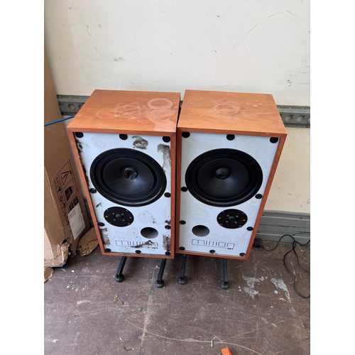 64 - Wooden speakers with visible wear and dust. Features include dual speaker drivers. Brand or specific... 
