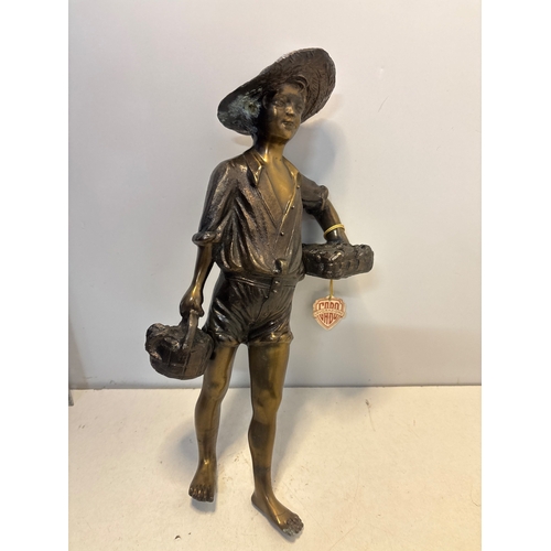 79 - Bronze-toned Capo Lavorazione figurine of a boy holding items; good condition.