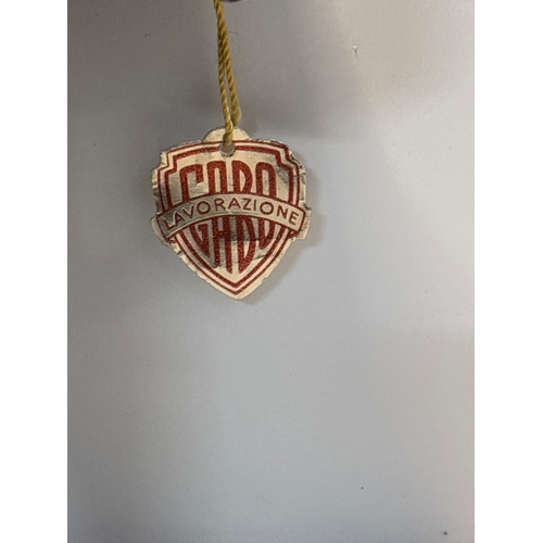 79 - Bronze-toned Capo Lavorazione figurine of a boy holding items; good condition.