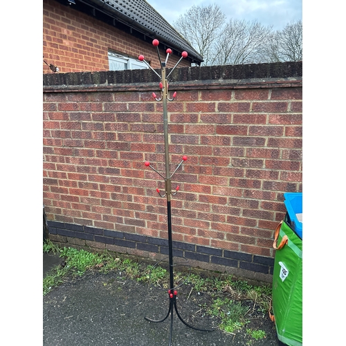 104 - 1950sMetal coat rack with red ball accents and sturdy curved base.