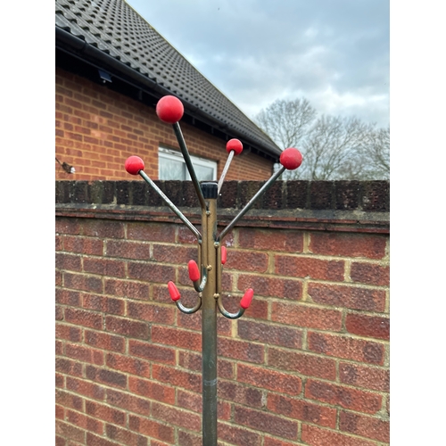 104 - 1950sMetal coat rack with red ball accents and sturdy curved base.