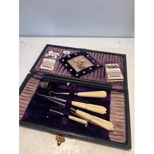 14 - Victorian sewing box with tools and needles; lined interior.