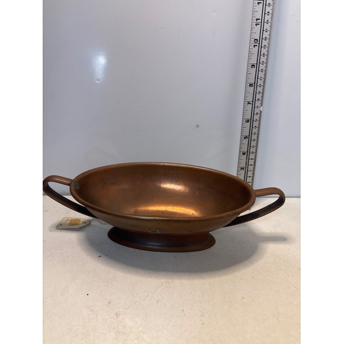 2 - Copper bowl with two handles, standing on a pedestal base.