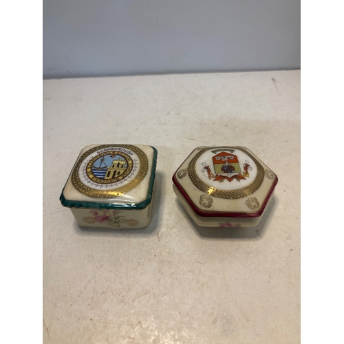 20 - Decorative ceramic boxes with printed designs.
