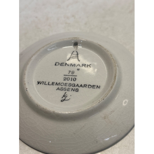 21 - Small ceramic plate from Denmark, marked 'Willemoesgaarden Assens 2010'. Features a blue design on t... 