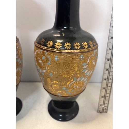 23 - Black ceramic Royal Daltonvases with gilt floral accents, marked No. 536 and 7009 not postable.