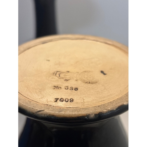 23 - Black ceramic Royal Daltonvases with gilt floral accents, marked No. 536 and 7009 not postable.