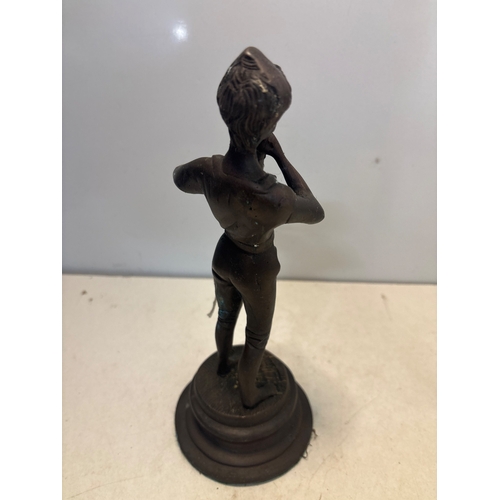 27 - Bronze figurine depicting a flute player with detailed features, standing on a round pedestal base. ... 