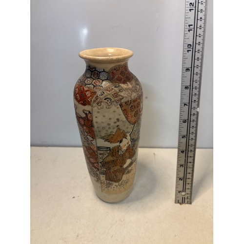 28 - Hand-painted Japanese ceramic vase with detailed motifs.