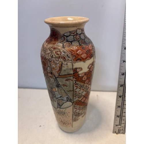 28 - Hand-painted Japanese ceramic vase with detailed motifs.
