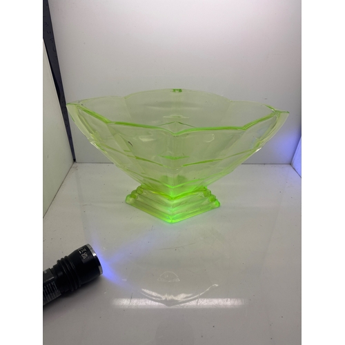 34 - Green uranium glass bowl with scalloped edges and pedestal.