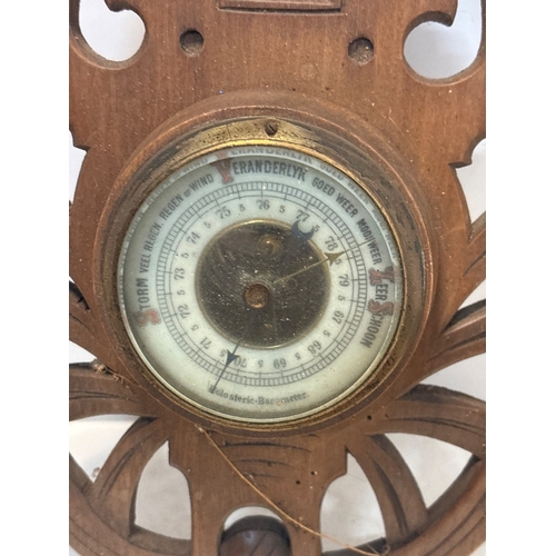 35 - Ornate wooden barometer and thermometer combo, featuring intricate carving and a vintage aesthetic, ... 