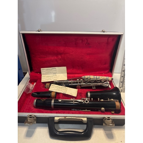38 - Boosey & Hawkes clarinet with case and parts, in worn condition.
