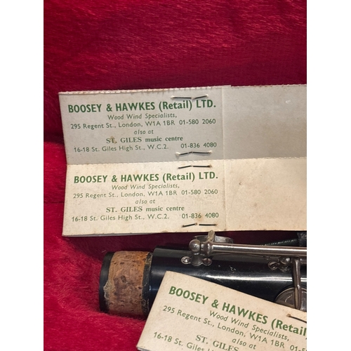 38 - Boosey & Hawkes clarinet with case and parts, in worn condition.
