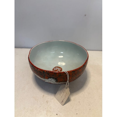 41 - Japanese ceramic bowl with red glaze, crane motif, marked base.