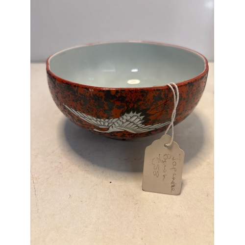 41 - Japanese ceramic bowl with red glaze, crane motif, marked base.