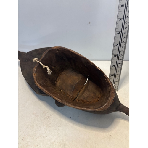 42 - Hand-carved African wooden mask, featuring intricate details and a hair comb design. Hollow interior... 